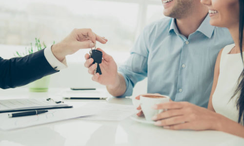 Mortgage Broker Speaking to Young Couple