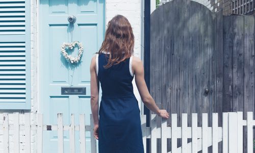 woman outside house