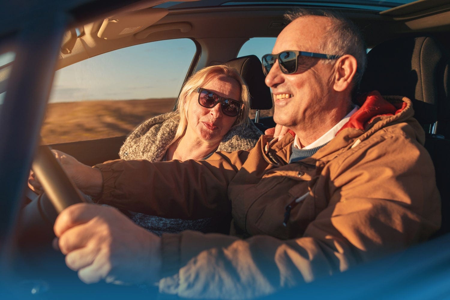 Senior couple driving - life insurance comparison