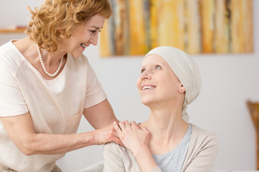 Woman supports her friend undergoing cancer treatment